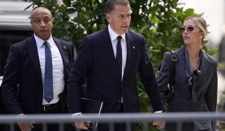 Hunter Biden, center, and his wife, Melissa Cohen Biden, right, arrive at federal court, Monday, June 3, 2024, in Wilmington, Del. (AP Photo/Matt Slocum)