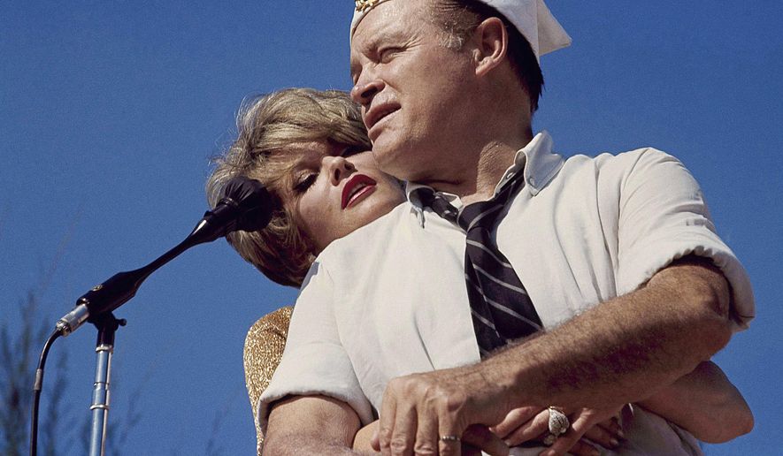 Bob Hope and Janis Paige hug during the annual Christmas show in Saigon, Vietnam, Dec. 25, 1964. Paige, a popular actor in Hollywood and in Broadway musicals and comedies who danced with Fred Astaire, toured with Bob Hope and continued to perform into her 80s, has died Sunday, June 2, 2024, of natural causes at her Los Angeles home, longtime friend Stuart Lampert said Monday, June 3. (AP Photo, File)