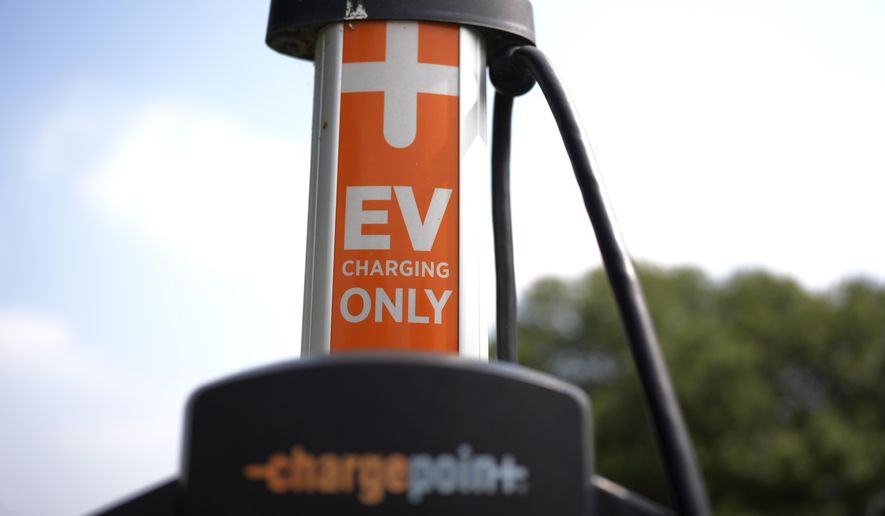 An EV charging station is seen Thursday, May 9, 2024, in San Antonio. Many Americans still aren’t sold on going electric for their next car purchase. High prices and a lack of easy-to-find charging stations are major sticking points, a new poll shows. (AP Photo/Eric Gay)