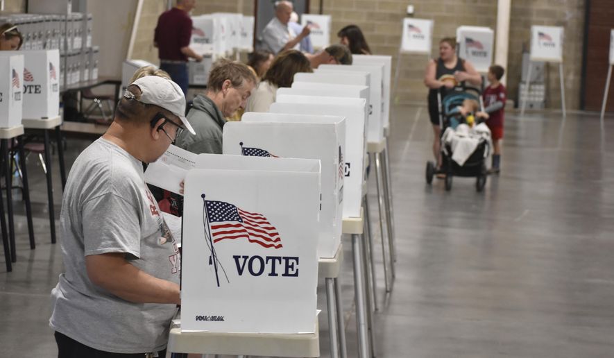 Voters cast ballots at the MetraPark events center, Tuesday, June 4, 2024, in Billings, Mont. The primary election included candidates for president, U.S. Senate, governor and other offices. (AP Photo/Matthew Brown)