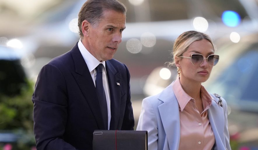Hunter Biden, left, arrives with his wife, Melissa Cohen Biden at federal court, Tuesday, June 4, 2024, in Wilmington, Del. (AP Photo/Matt Slocum)