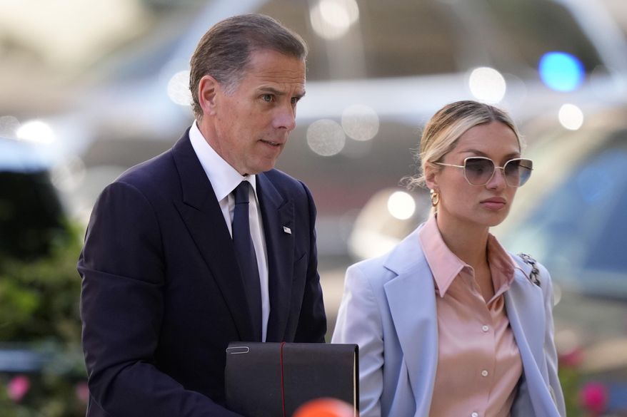 Hunter Biden, left, arrives with his wife, Melissa Cohen Biden at federal court, Tuesday, June 4, 2024, in Wilmington, Del. (AP Photo/Matt Slocum)