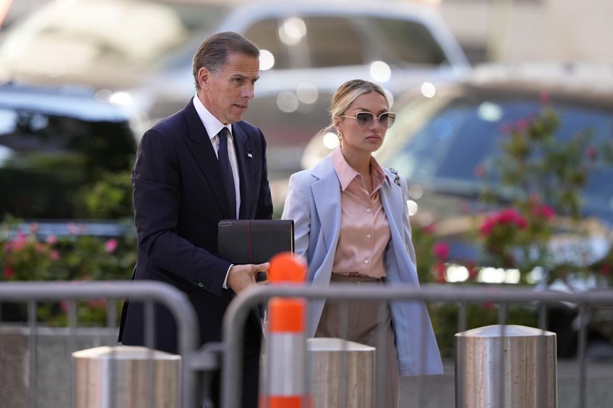 Hunter Biden, left, arrives with his wife, Melissa Cohen Biden at federal court, Tuesday, June 4, 2024, in Wilmington, Del. (AP Photo/Matt Slocum)