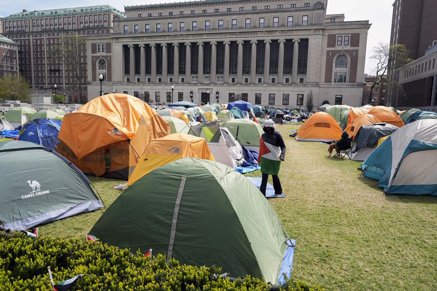 Student protesters camp on the campus of Columbia University, April 30, 2024, in New York. Columbia has agreed to take additional steps to make its students feel secure on campus under a settlement reached Tuesday, June 4, with a Jewish student who had sought a court order requiring the Ivy League school provide safe access to the campus amid protests over the Israel-Hamas war. (AP Photo/Mary Altaffer, Pool, File)