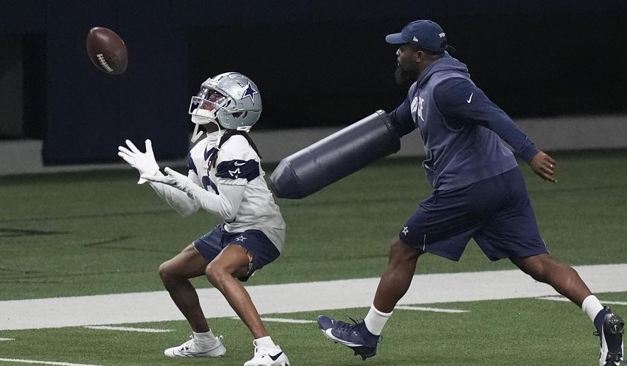 Dallas Cowboys' KaVontae Turpin, left, works a special teams kick return drill during an NFL football team practice in Frisco, Texas, Wednesday, May 22, 2024. The NFL is bringing the kickoff back to life, starting with teams investing time in offseason workouts — with plans for plenty more in training camps — into something that had become a pointless exercise. (AP Photo/LM Otero, File)
