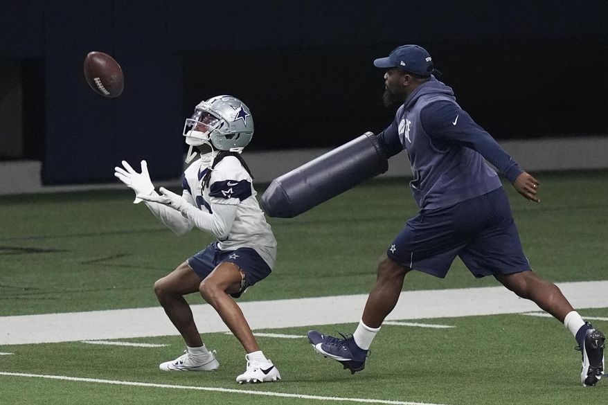 Dallas Cowboys' KaVontae Turpin, left, works a special teams kick return drill during an NFL football team practice in Frisco, Texas, Wednesday, May 22, 2024. The NFL is bringing the kickoff back to life, starting with teams investing time in offseason workouts — with plans for plenty more in training camps — into something that had become a pointless exercise. (AP Photo/LM Otero, File)