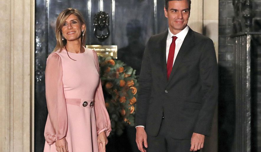 Spanish Prime Minister Pedro Sanchez and his wife Begoña Gómez arrive at 10 Downing Street, in London, Dec. 3, 2019. A Spanish investigative judge has summoned the wife of Spain’s prime minister to give testimony as part of a probe into allegations that she used her position to influence business deals, a Madrid-based court said Tuesday, June 4, 2024. Gómez is to appear at court on July 5 to answer questions. (AP Photo/Alastair Grant, File)