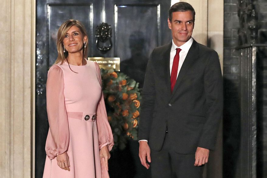 Spanish Prime Minister Pedro Sanchez and his wife Begoña Gómez arrive at 10 Downing Street, in London, Dec. 3, 2019. A Spanish investigative judge has summoned the wife of Spain’s prime minister to give testimony as part of a probe into allegations that she used her position to influence business deals, a Madrid-based court said Tuesday, June 4, 2024. Gómez is to appear at court on July 5 to answer questions. (AP Photo/Alastair Grant, File)