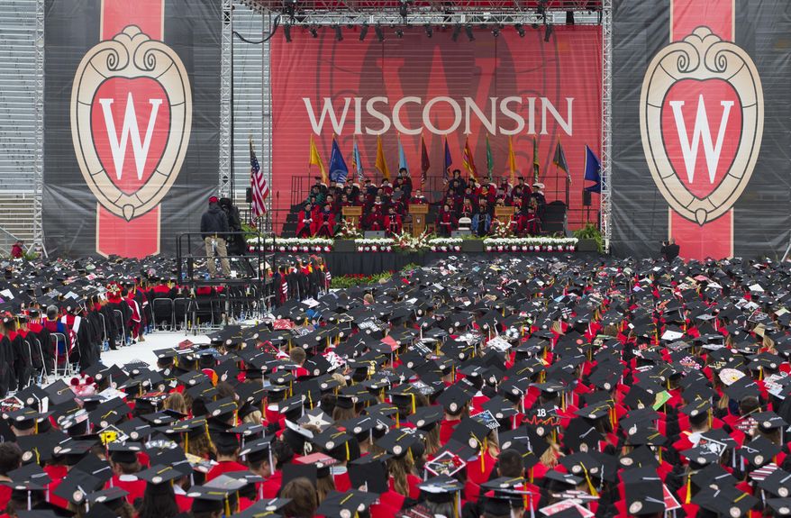 FILE - David Muir of ABC News gives the commencement address during graduation at the University of Wisconsin in Madison, Wis., on Saturday, May 12, 2018. A conservative University of Wisconsin regent who originally refused to step down even though his term was over has resigned, clearing the way for his successor named by Democratic Gov. Tony Evers to take his spot. Regent Bob Atwell notified university leaders Monday, June 3, 2024, that he was resigning. AP Photo/Jon Elswick, File)