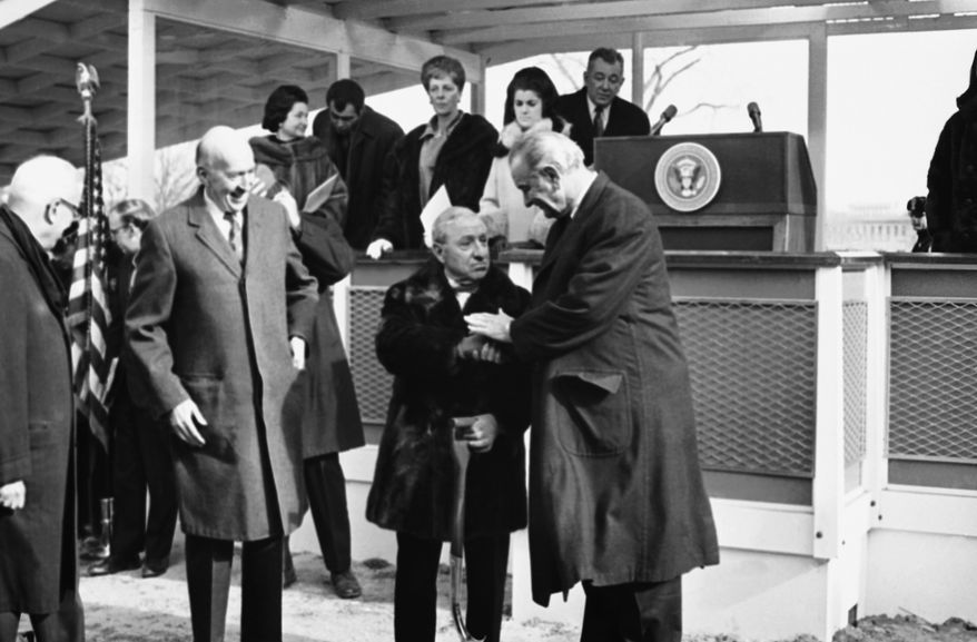 President Lyndon Johnson offers his congratulations to Joseph H. Hirshhorn during groundbreaking ceremonies for the Smithsonian Institution's Hirshhorn Museum and Sculpture Garden in Washington, Jan. 8, 1969. Hirshhorn donated more than 6,000 paintings and sculptures to the museum. (AP Photo)