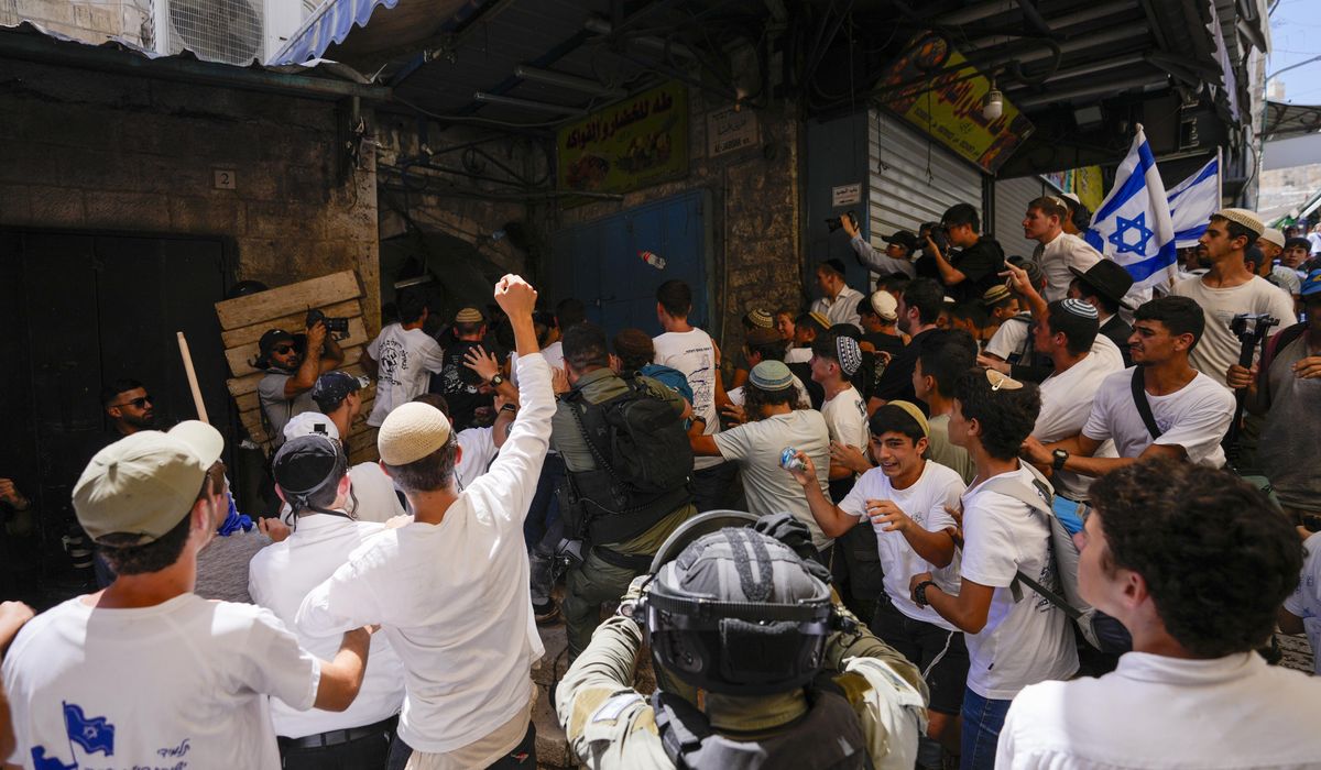 NextImg:Israeli nationalists march through Palestinian area of Jerusalem, some chanting ‘Death to Arabs’