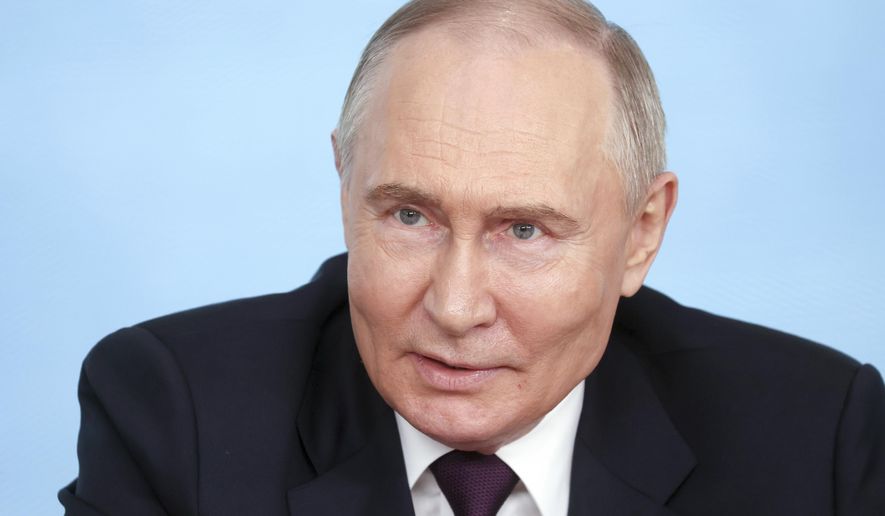 Russian President Vladimir Putin speaks to senior news leaders of international news agencies on the sidelines of the St. Petersburg International Economic Forum at the Lakhta Center skyscraper, the headquarters of Russian gas monopoly Gazprom in St. Petersburg, Russia, on Wednesday, June 5, 2024. The Russian leader has used the annual forum as a showcase for touting Russia's development and seeking investors. (Valentina Pevtsova, Sputnik, Kremlin Pool Photo via AP)