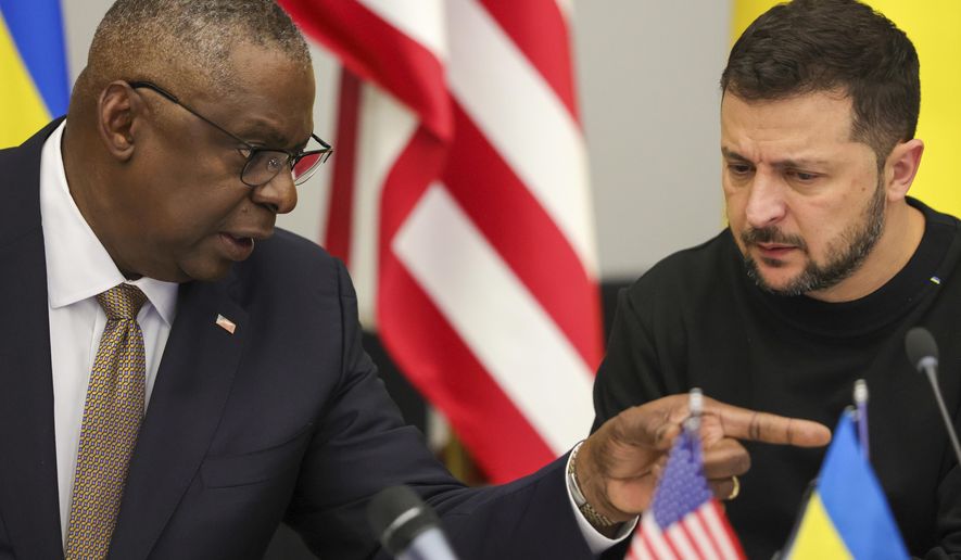 FILE - U.S. Secretary of Defense Lloyd Austin, left, speaks with Ukraine's President Volodymyr Zelenskyy during the Ukraine Defense Contact Group meeting of NATO defense ministers at NATO headquarters in Brussels, Oct. 11, 2023. Ukraine has used U.S weapons to attack inside Russia in recent days. That's according to a Western official familiar with the matter. The weapons were used under recently approved guidance from President Joe Biden allowing American arms to be used to strike inside Russia for the limited purpose of defending Kharkiv, Ukraine’s second-largest city. (Olivier Matthys, Pool Photo via AP, File)