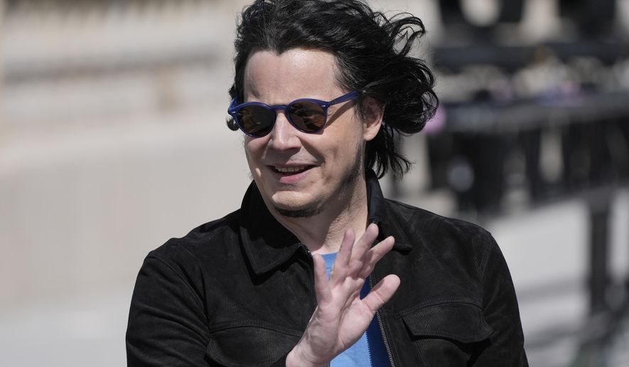 Musician Jack White waves before being honored by the Michigan Central Station, Thursday, June 6, 2024, in Detroit. (AP Photo/Carlos Osorio)