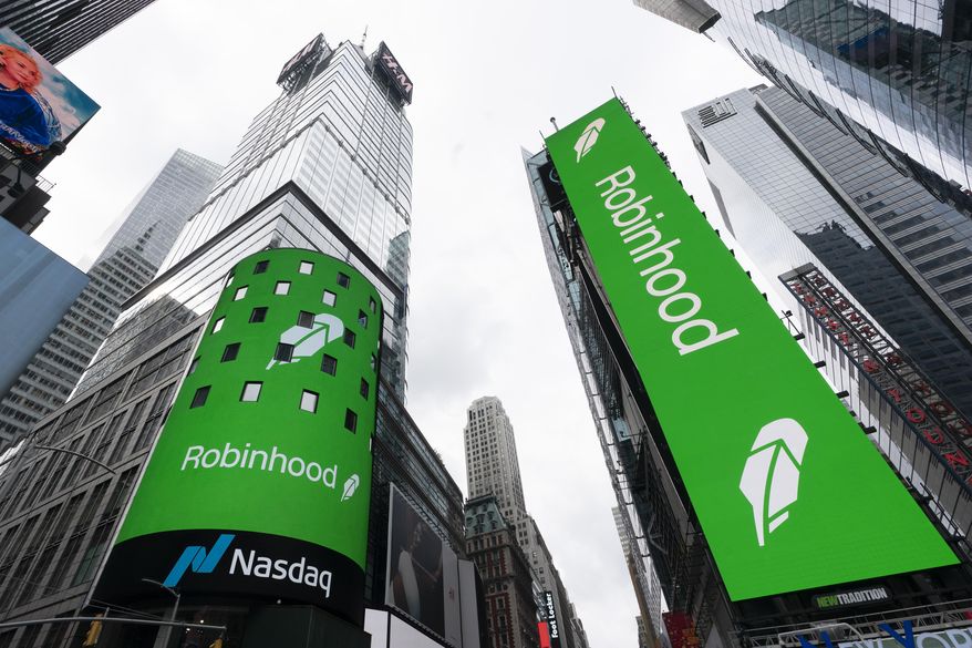 Electronic screens in New York's Times Square announce the Robinhood IPO, July 29, 2021. Robinhood Markets Inc. is buying crytocurrency exchange Bitstamp, Thursday, June 6, 2024, for about $200 million as the company looks to speed up its cryptocurrency expansion globally. (AP Photo/Mark Lennihan, File)