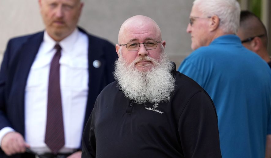 Jason Turner, center, departs from federal court, Friday, June 7, 2024, in Wilmington, Del. (AP Photo/Matt Slocum)