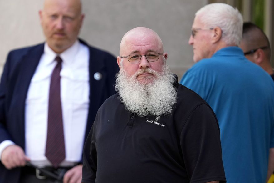 Jason Turner, center, departs from federal court, Friday, June 7, 2024, in Wilmington, Del. (AP Photo/Matt Slocum)