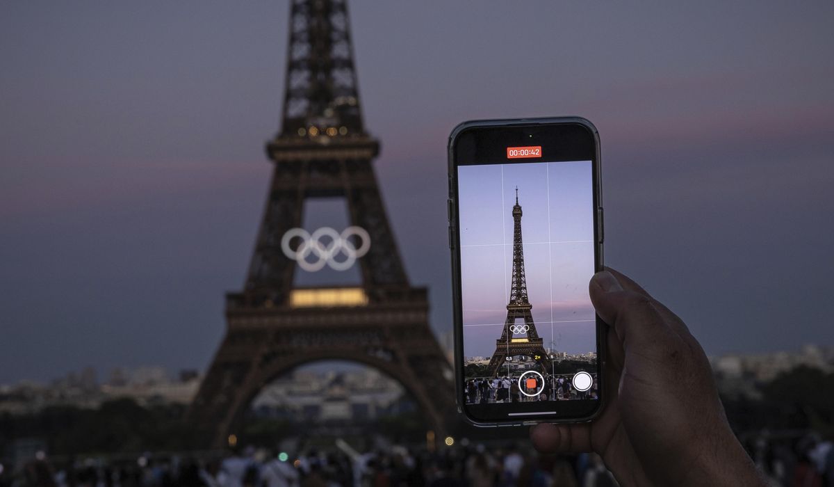 NextImg:The Olympic rings are mounted on the Eiffel Tower to mark 50 days until the Paris Games