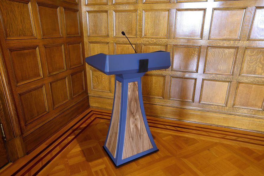 The lectern purchased by the administration of Arkansas Gov. Sarah Huckabee Sanders in June 2023 sits in a corner in the Governor's Conference Room at the state Capitol, Sept. 26, 2023, in Little Rock, Ark. A prosecutor said Friday, June 7, 2024, he will not file any criminal charges over the purchase of a $19,000 lectern by the governor's office that attracted nationwide scrutiny. (Thomas Metthe/Arkansas Democrat-Gazette via AP, File)