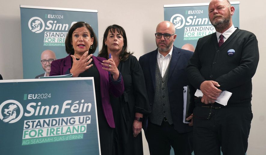 Sinn Fein President Mary Lou McDonald, left, speaks at the launch of the party's manifesto for the European election campaign at Temple Bar Gallery and Studios in Dublin, Thursday, May 30, 2024. (Brian Lawless/PA via AP)