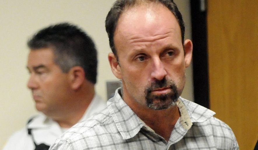 Defendant John Bittrolff appears for a hearing at Riverhead Criminal Court, Thursday, July 31, 2014, in Riverhead, N.Y. New charges brought against Rex Heuermann, the man accused of a string of killings on Long Island, are raising new questions about the strength of Bittrolff's conviction. (James Carbone/Newsday via AP, Pool)
