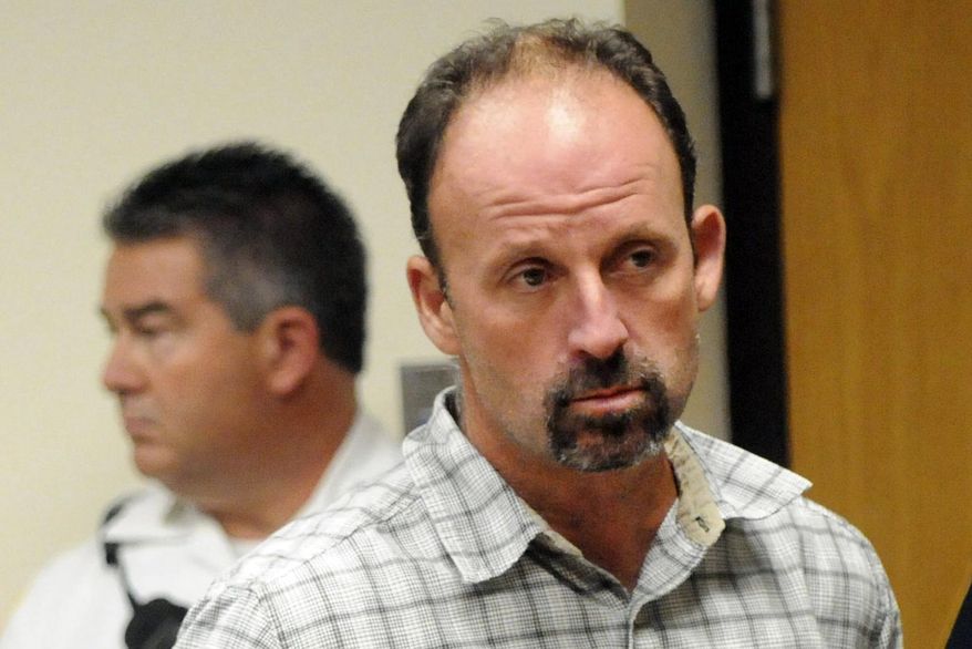 Defendant John Bittrolff appears for a hearing at Riverhead Criminal Court, Thursday, July 31, 2014, in Riverhead, N.Y. New charges brought against Rex Heuermann, the man accused of a string of killings on Long Island, are raising new questions about the strength of Bittrolff's conviction. (James Carbone/Newsday via AP, Pool)