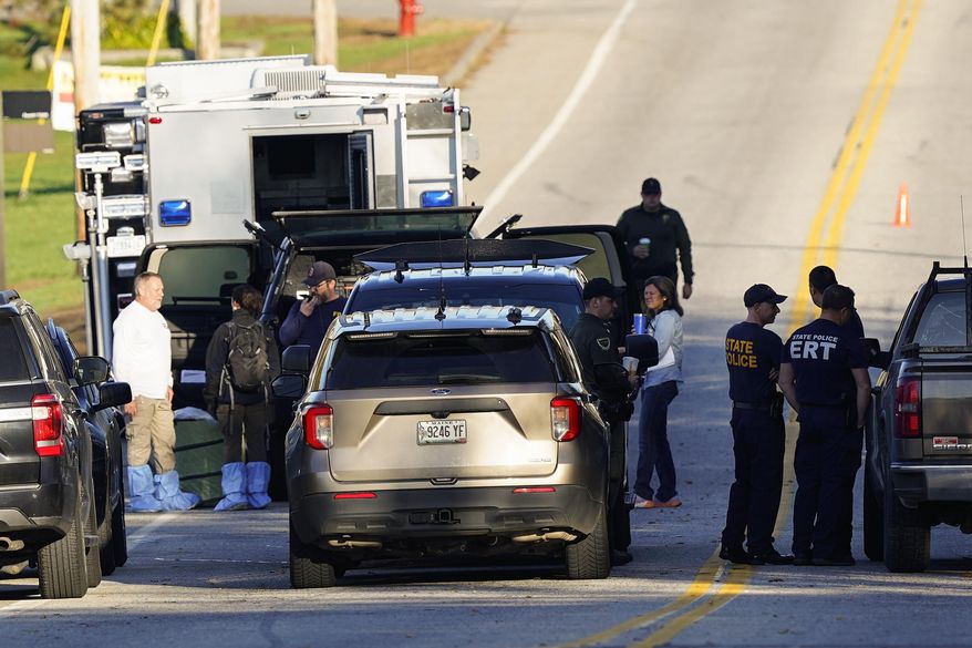 Law enforcement officers maintain their presence at Schemengees Bar and Grille in the aftermath of a mass shooting in Lewiston, Maine, Saturday, Oct. 28, 2023. Thousands of pages Maine State Police documents released Friday, June 7, 2023, include detailed descriptions of the chaos and carnage surrounding the state’s deadliest mass shooting. (AP Photo/Matt Rourke, File)