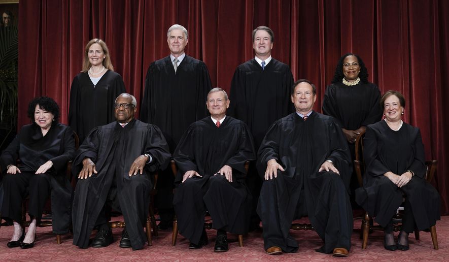 Members of the Supreme Court sit for a new group portrait following the addition of Associate Justice Ketanji Brown Jackson, at the Supreme Court building in Washington, Oct. 7, 2022. Bottom row, from left, Associate Justice Sonia Sotomayor, Associate Justice Clarence Thomas, Chief Justice of the United States John Roberts, Associate Justice Samuel Alito, and Associate Justice Elena Kagan. Top row, from left, Associate Justice Amy Coney Barrett, Associate Justice Neil Gorsuch, Associate Justice Brett Kavanaugh, and Associate Justice Ketanji Brown Jackson. (AP Photo/J. Scott Applewhite, file)