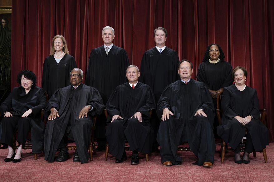 Members of the Supreme Court sit for a new group portrait following the addition of Associate Justice Ketanji Brown Jackson, at the Supreme Court building in Washington, Oct. 7, 2022. Bottom row, from left, Associate Justice Sonia Sotomayor, Associate Justice Clarence Thomas, Chief Justice of the United States John Roberts, Associate Justice Samuel Alito, and Associate Justice Elena Kagan. Top row, from left, Associate Justice Amy Coney Barrett, Associate Justice Neil Gorsuch, Associate Justice Brett Kavanaugh, and Associate Justice Ketanji Brown Jackson. (AP Photo/J. Scott Applewhite, file)