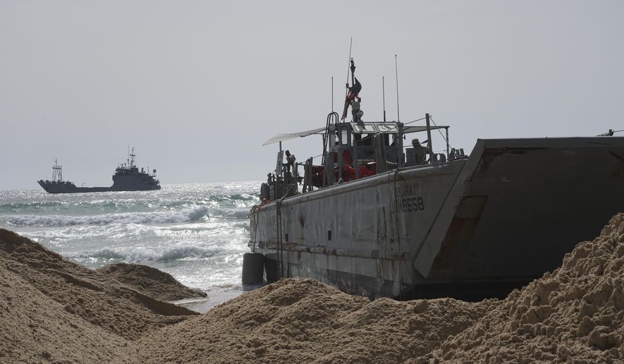 A U.S. Army landing craft is seen beached in Ashdod, May 26, 2024, after being swept by wind and current from the temporary humanitarian pier in the Gaza Strip. A key section of the U.S. military-built pier designed to carry badly needed aid into Gaza by boat has been reconnected to the Gaza beach following storm damage repairs and aid will begin to flow soon, the U.S. Central Command announced Friday. (AP Photo/Tsafrir Abayov) **FILE**