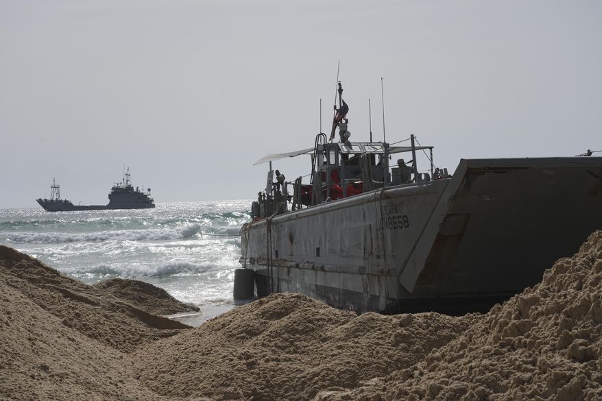 A U.S. Army landing craft is seen beached in Ashdod, May 26, 2024, after being swept by wind and current from the temporary humanitarian pier in the Gaza Strip. A key section of the U.S. military-built pier designed to carry badly needed aid into Gaza by boat has been reconnected to the Gaza beach following storm damage repairs and aid will begin to flow soon, the U.S. Central Command announced Friday. (AP Photo/Tsafrir Abayov) **FILE**