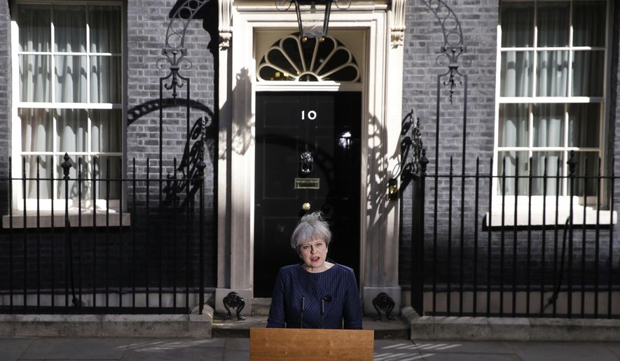 Britain's Prime Minister Theresa May speaks to the media outside her official residence of 10 Downing Street in London, Tuesday April 18, 2017. Theresa May, who succeeded David Cameron after he resigned following Britain's vote to leave the European Union in a referendum in June 2016, sought to capitalize on the Conservative Party's big opinion poll lead and called an early general election for June 2017. (AP Photo/Alastair Grant, File)