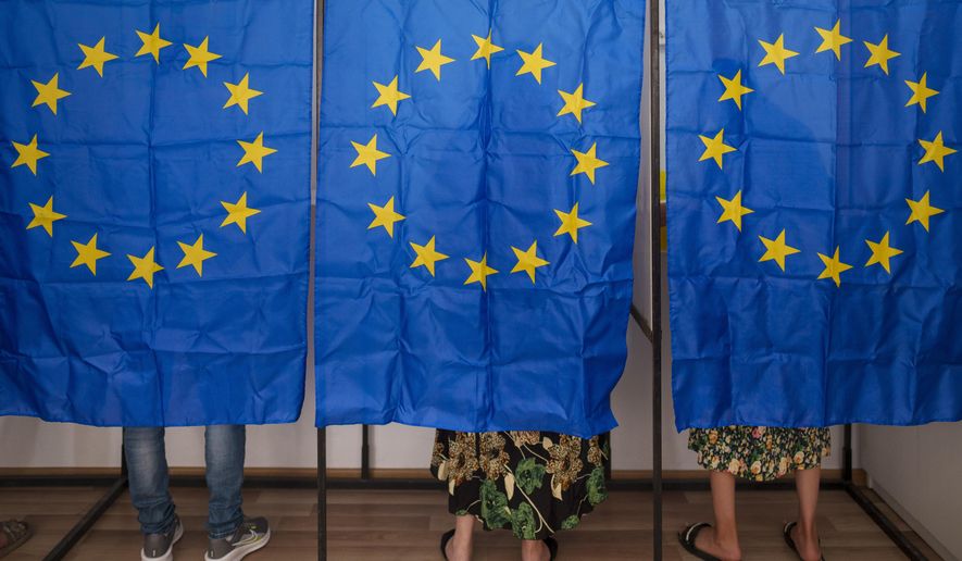 People vote in European and local elections in Baleni, Romania, Sunday, June 9, 2024. Voters across the European Union are going to the polls on the final day of voting for the European parliamentary elections to choose their representatives for the next five-year term. (AP Photo/Vadim Ghirda)