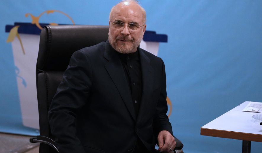 Iran's hard-line parliament speaker Mohammad Bagher Qalibaf sits while registering his name as a candidate for the June 28 presidential election at the Interior Ministry, in Tehran, Iran, Monday, June 3, 2024. Iran's Guardian Council on Sunday, June, 9, approved the country's hard-line parliament speaker and five others to run in the country's presidential election following a helicopter crash that killed President Ebrahim Raisi and seven others. (AP Photo/Vahid Salemi)