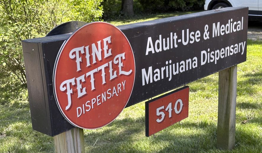 A sign advertises the Fine Fettle cannabis dispensary on June 4, 2024, in West Tisbury, Mass.. Unless something changes, Martha's Vineyard is about to run out of pot, affecting more than 230 registered medical users and thousands more recreational ones. (AP Photo/Nick Perry)