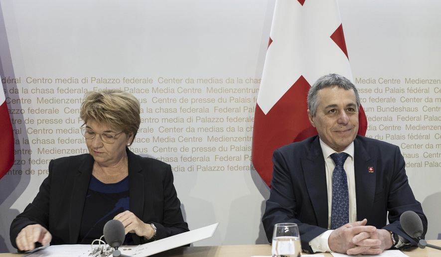 Swiss Federal Councillor Ignazio Cassis, right, and Swiss Federal Councillor Viola Amherd take part in a media conference on the peace conference in Bern, Switzerland,Monday, June 10, 2024. Switzerland’s president says nearly 90 countries and organizations, half from Europe, have confirmed attending the Swiss-hosted Ukraine peace summit on June 15-16 despite Russia’s refusal to participate. Viola Amherd told reporters Monday that the summit will aim to chart a path toward possible peace nearly 28 months after Russian forces invaded Ukraine. (Peter Schneider/Keystone via AP)