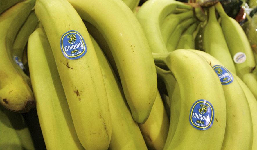 Chiquita bananas are piled on display at the Heinen's grocery store in Bainbridge, Ohio in this Aug. 3, 2005 file photo. A federal jury in Florida found that Chiquita Brands must pay $38.3 million to 16 family members of people killed during Colombia’s long civil war by a violent right-wing paramilitary group funded by the company. The verdict Monday, June 10, 2024, by a jury in West Palm Beach marks the first time the company has been found liable in any of multiple similar lawsuits pending elsewhere in U.S. courts, lawyers for the plaintiffs said. (AP Photo/Amy Sancetta, file)