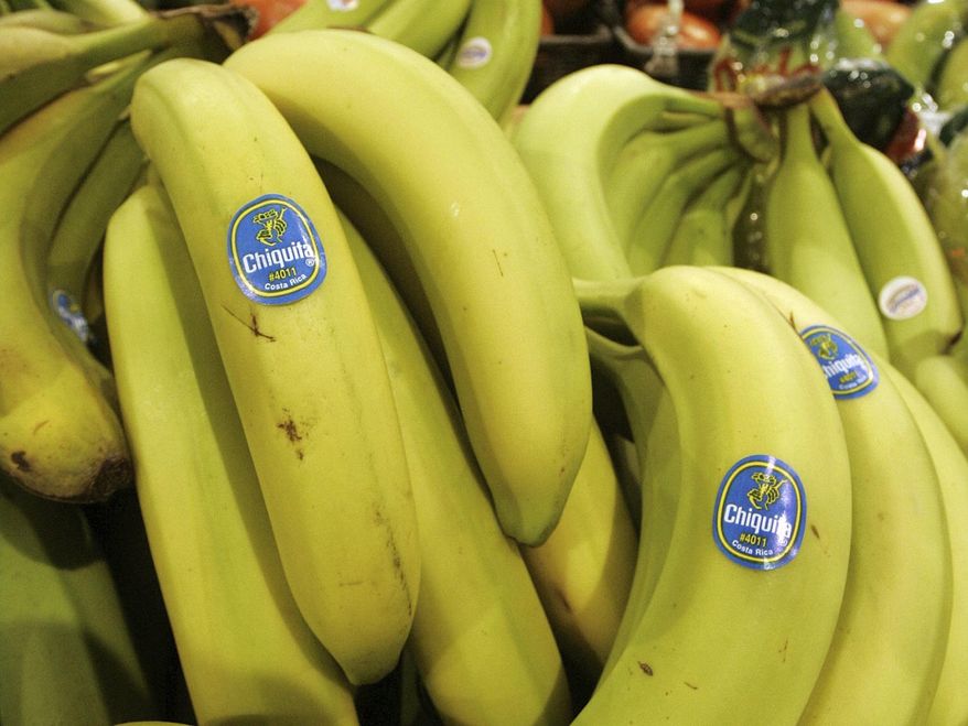 Chiquita bananas are piled on display at the Heinen's grocery store in Bainbridge, Ohio in this Aug. 3, 2005 file photo. A federal jury in Florida found that Chiquita Brands must pay $38.3 million to 16 family members of people killed during Colombia’s long civil war by a violent right-wing paramilitary group funded by the company. The verdict Monday, June 10, 2024, by a jury in West Palm Beach marks the first time the company has been found liable in any of multiple similar lawsuits pending elsewhere in U.S. courts, lawyers for the plaintiffs said. (AP Photo/Amy Sancetta, file)