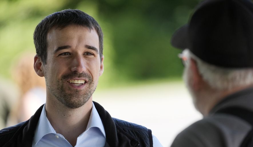 State Rep. Austin Theriault, R-Fort Kent, speaks with a voter, Tuesday, June 11, 2024, in Fairfield, Maine. (AP Photo/Robert F. Bukaty) ** FILE **