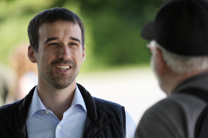 State Rep. Austin Theriault, R-Fort Kent, speaks with a voter, Tuesday, June 11, 2024, in Fairfield, Maine. (AP Photo/Robert F. Bukaty) ** FILE **