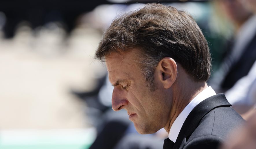 French President Emmanuel Macron attends a WWII in Oradour-sur-Glane, southwestern France, Monday, June 10, 2024. French President Emmanuel Macron called snap legislative elections, saying he could not ignore the new political reality after his pro-European party was handed a chastening defeat and projected to garner less than half the support of Marine Le Pen's National Rally. (Ludovic Marin via AP)