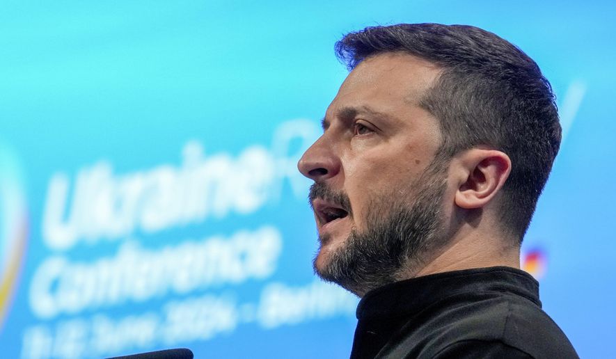 Ukrainian President Volodymyr Zelenskyy speaks during the opening ceremony of the recovery conference in Berlin, Germany, Tuesday, June 11, 2024. Germany is hosting a conference to gather support for Ukraine's recovery from the destruction wreaked by Russia's war, sending a new signal of solidarity with Kyiv at the start of a week of intense diplomacy. (AP Photo/Ebrahim Noroozi)