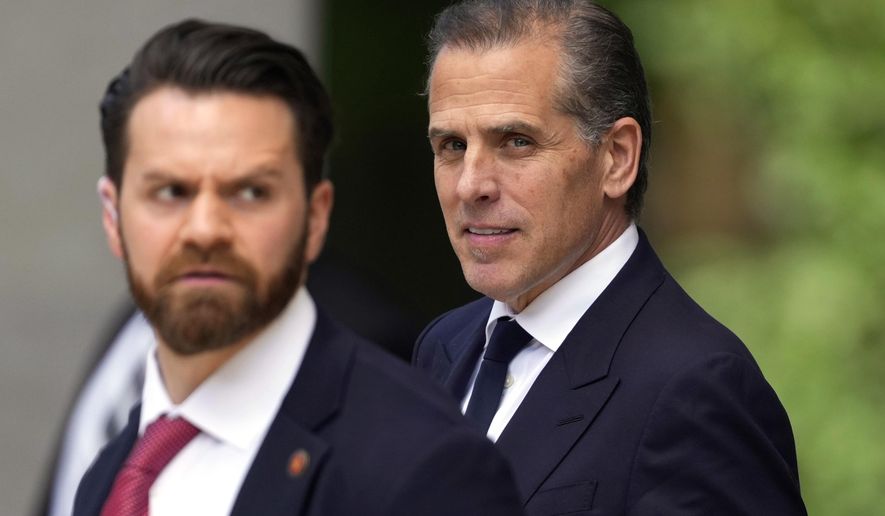 Hunter Biden, right, departs from federal court, Monday, June 10, 2024, in Wilmington, Del. (AP Photo/Matt Slocum)