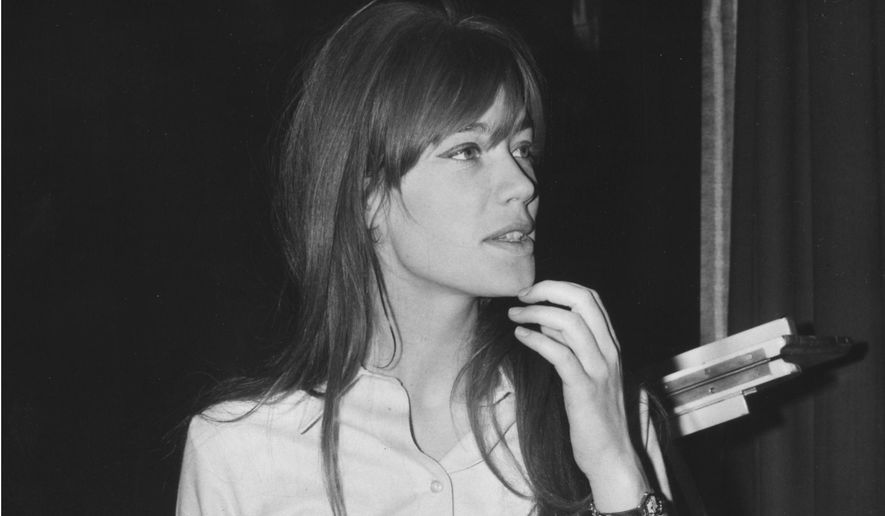 French singing star, Francoise Hardy, looks at a music score during a break in rehearsals, January 31, 1966, at the Savoy Hotel in London, England, where she is to appear for a three-week cabaret spot. Francoise Hardy, a beloved French singer and pop culture icon since the 1960s, has died at age 80. Her son, musician Thomas Dutronc, announced her death on social networks. (AP Photo, File)