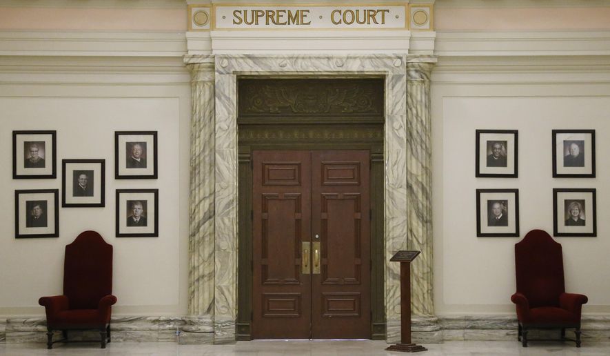 The Oklahoma Supreme Court is pictured in the state Capitol building in Oklahoma City, May 19, 2014. The Oklahoma Supreme Court on Wednesday, June 12, 2024, dismissed a lawsuit of the last two survivors of the 1921 Tulsa Race Massacre, dampening the hope of advocates for racial justice that the government would make amends for one of the worst single acts of violence against Black people in U.S. history. (AP Photo/Sue Ogrocki, File)