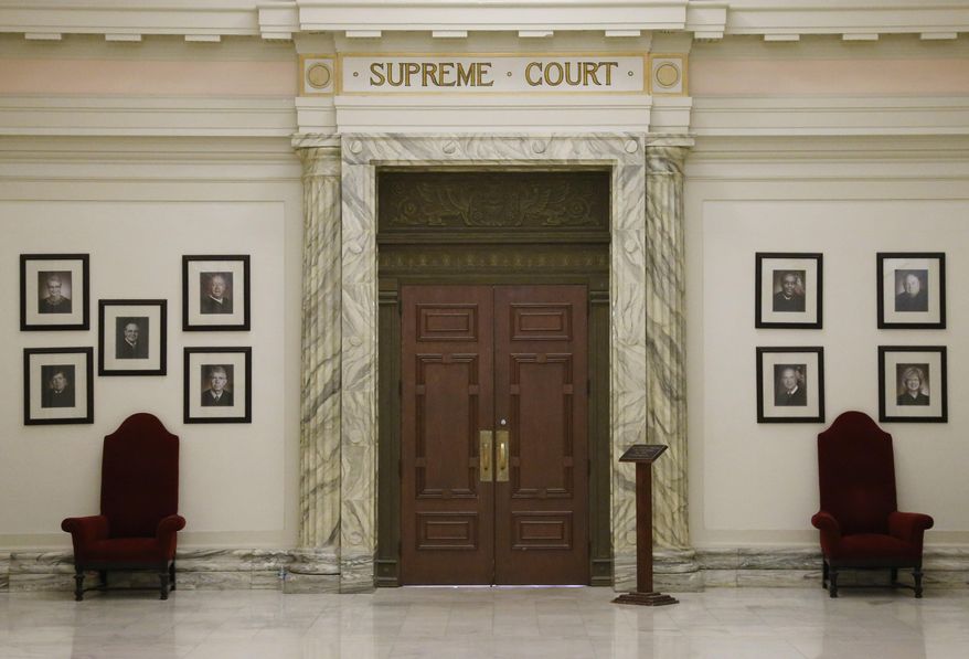 The Oklahoma Supreme Court is pictured in the state Capitol building in Oklahoma City, May 19, 2014. The Oklahoma Supreme Court on Wednesday, June 12, 2024, dismissed a lawsuit of the last two survivors of the 1921 Tulsa Race Massacre, dampening the hope of advocates for racial justice that the government would make amends for one of the worst single acts of violence against Black people in U.S. history. (AP Photo/Sue Ogrocki, File)