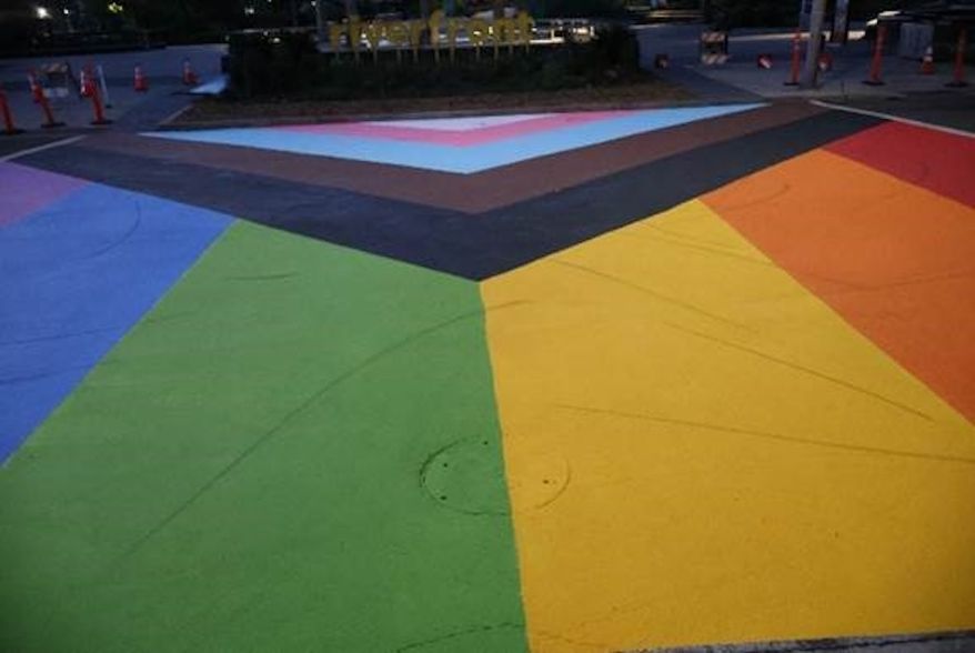 An adult and two minors were arrested and booked on malicious mischief on June 5, 2024, for using their Lime motorized e-scooters to leave skid marks on the Pride crosswalk at Riverfront Park in Spokane, Washington. (Spokane Police Department photo)