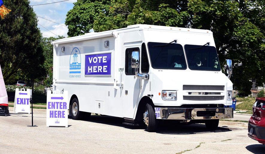 The City of Racine Clerk's Office mobile voting van is seen on July 26, 2022, at the Dr. Martin Luther King Community Center in Racine, Wis. The Wisconsin Supreme Court late Tuesday, June 11, kept in place for now a lower court's ruling banning the use of mobile voting sites in the upcoming presidential election, a win for Republicans. (Ryan Patterson/The Journal Times via AP, File)