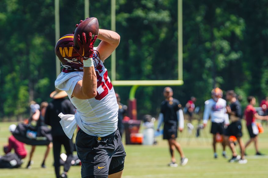 Washington Commanders tight end Ben Sinnot (82) goes for an aerial catch at Commanders mini camp at the OrthoVirginia Training Center at Commanders Park in Ashburn, Virginia, June 13, 2024. (Photo by Jordan Sabillo for Washington Times)