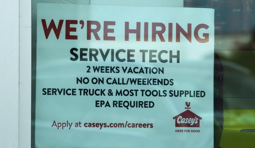 A hiring sign is displayed at a gas station in Vernon Hills, Ill., Monday, June 3, 2024. On Thursday, June 13, 2024, the Labor Department reports on the number of people who applied for unemployment benefits last week. (AP Photo/Nam Y. Huh)